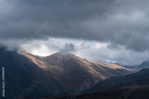 beautiful landscape in the highlands, textural hills with incident light.