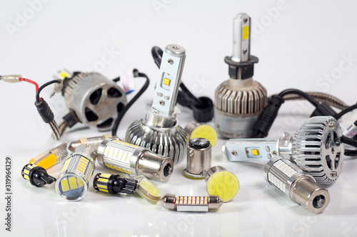 Light bulbs for car lamps. Automotive part in Silvery metallic and black color with wires and connecting elements