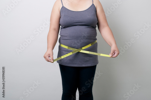 Portrait Of Smiling Woman Holding Tape Measure White