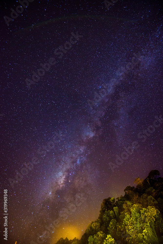 Fototapeta Naklejka Na Ścianę i Meble -  Milky way long exposure starry night with forest