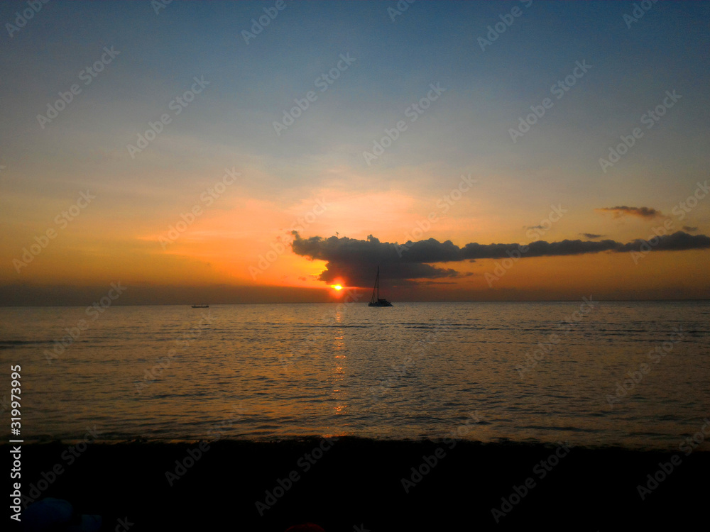 calming sunset on beach, bali - indonesia