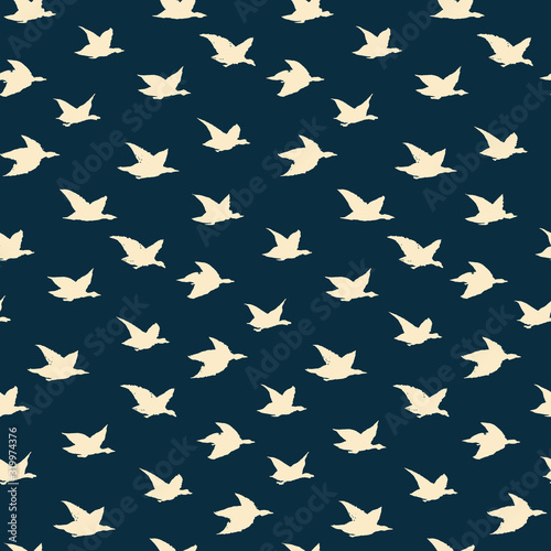Spring Swallow Birds Simple Print. Seamless Pattern with Yellow Birds Silhouettes for fabrics textile print design  wallpapers. Elegant flying crabe birds isolated on dark background