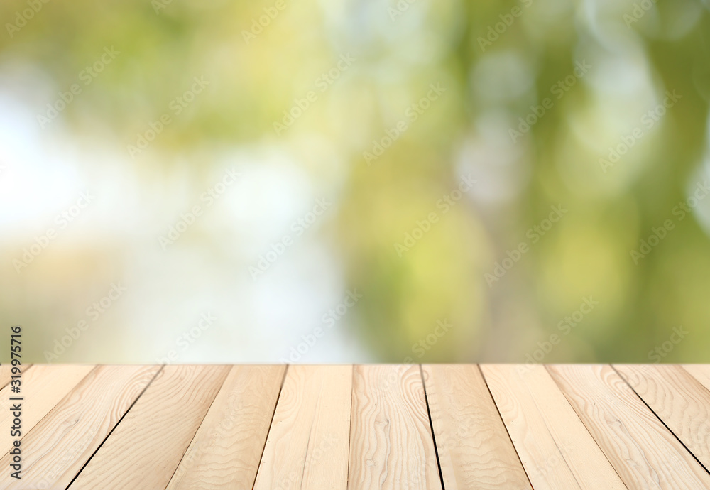 blurred background of green park in summer, Wood table top on shiny bokeh green background. For product display blurred background of green park in summer, Wood table top on shiny bokeh green background. For product display