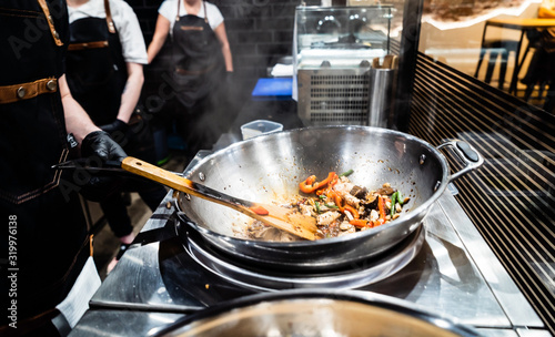 chef cooking in the restaurant photo