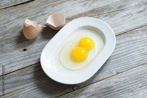 Canvas Print Twin or double egg yolk suggesting genetics or fertility concept