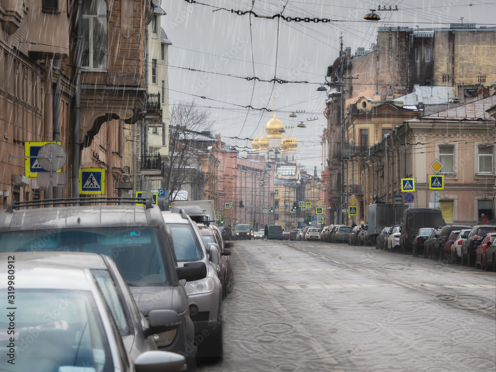 Rain in the city. Spring rain in the old district of the city