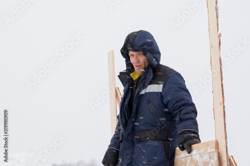 Portrait of a worker in overalls at a construction site © ads861
