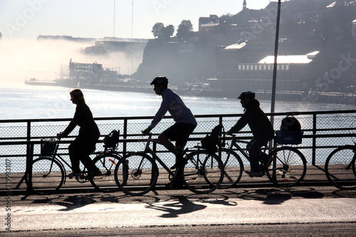 Photography Cyklister i siluett vid Slussen i Stockholm