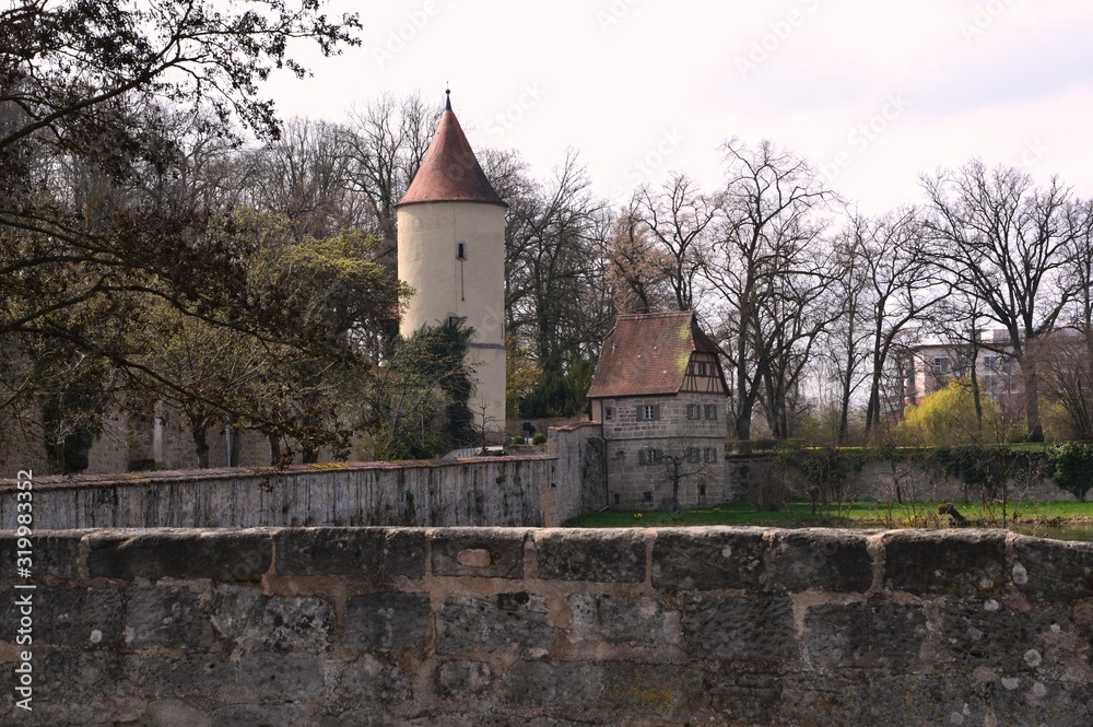 Dinkelsbühl (Germany). April 2017.  Dinkelsbühl is a medieval city in Germany. The fortress wall of the XIV-XV centuries is fully preserved with towers, gates, bastions.