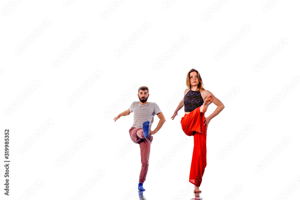 Dancing young couple on a white background