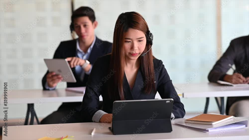 Assistant call centre team working operator with headsets. Assistant call centre team working operator with headsets.
