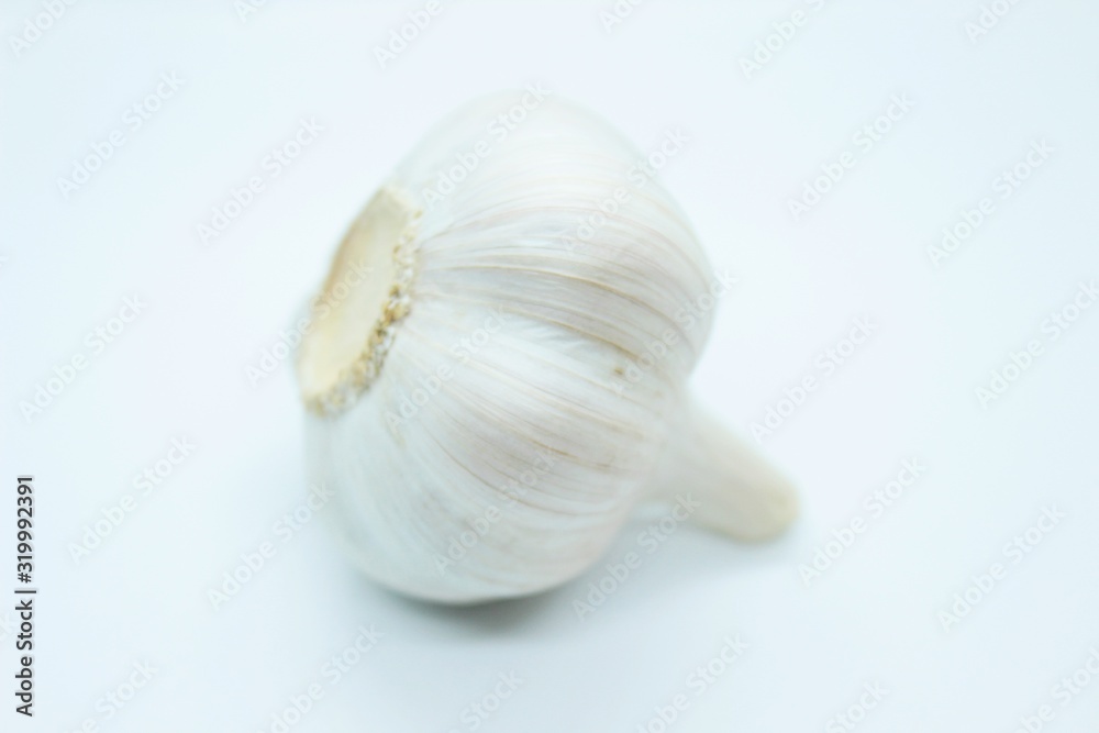Garlic head located on a white background Garlic head located on a white background