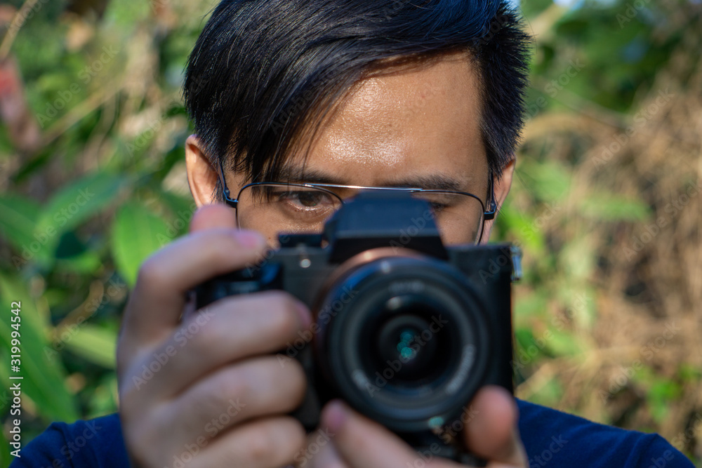 A close up asian man photographer in nature A close up asian man photographer in nature