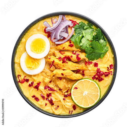 Ohn No Khao Swe isolated in white background. Oh No Khao Suey is Coconut Milk Noodle Soup of myanmar cuisine with chicken meat and eggs. Burmese food. photo