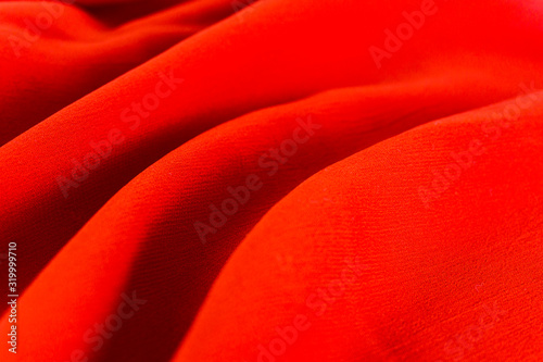 Crumpled red satin texture background