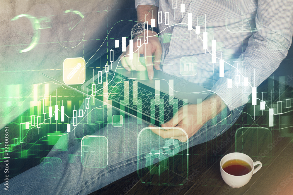Forex graph with businessman working on computer in office on background. Concept of analysis. Double exposure. Forex graph with businessman working on computer in office on background. Concept of analysis. Double exposure.