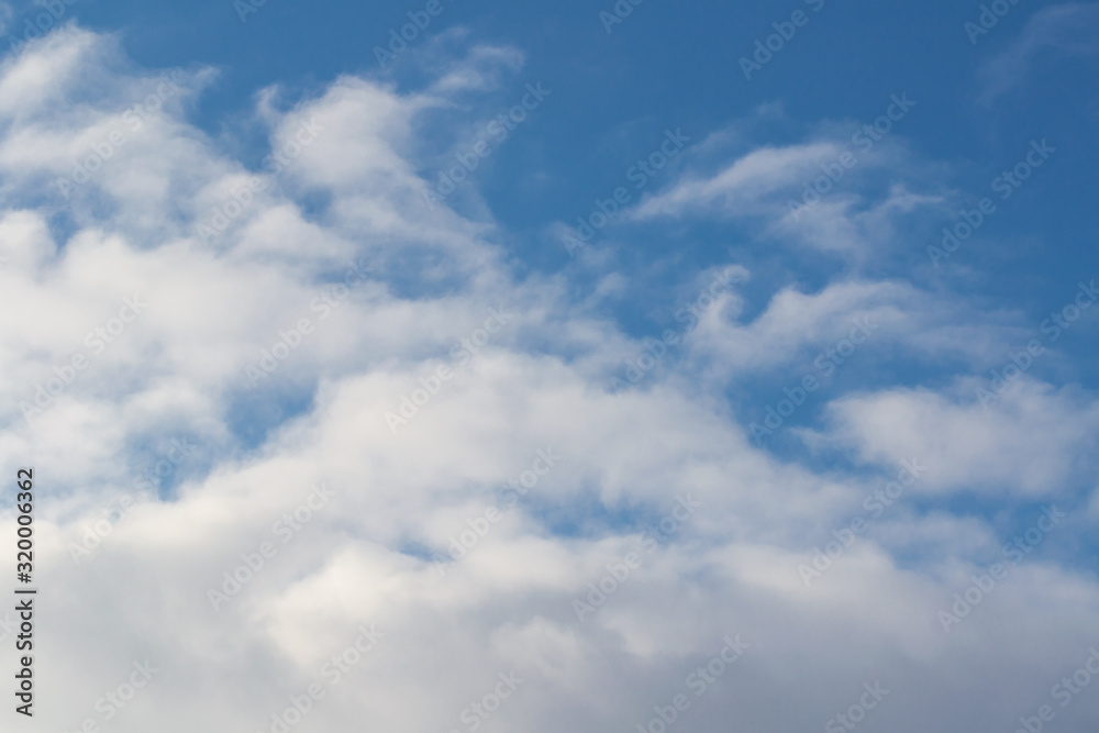 The sky is dark blue with cumulus white and gray clouds. Natural photography without processing.