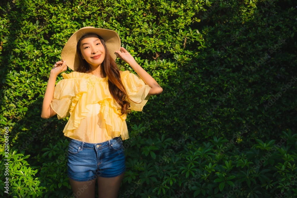 Portrait young asian woman happy smile relax around outdoor nature garden Portrait young asian woman happy smile relax around outdoor nature garden