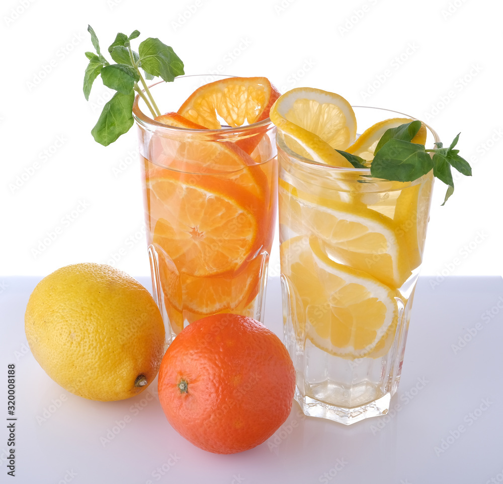 Fototapeta premium two glasses with lemon and tangerine drink and fruits