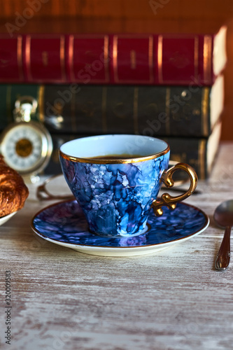 Blue vintage coffee cup  on a saucer