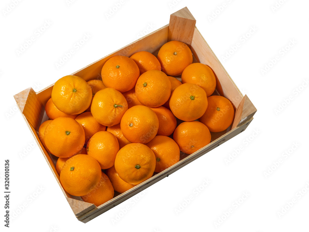 Tangerines in a wooden box. Isolated white background.