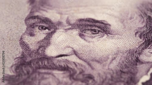 Michelangelo Buonarroti portrait on vintage Italy lira banknote rotating. Genius Italian sculptor and painter. Low angle, macro. 4K, 422 10 bit