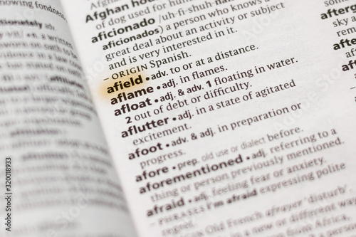 The word or phrase Afield in a dictionary.