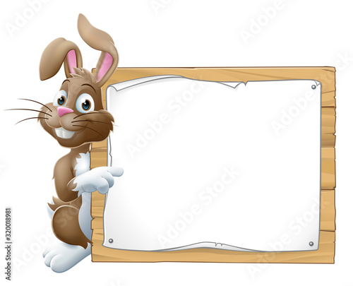 Easter bunny rabbit peeking around a sign and pointing background cartoon