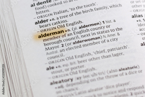 The word or phrase Alderman in a dictionary. photo