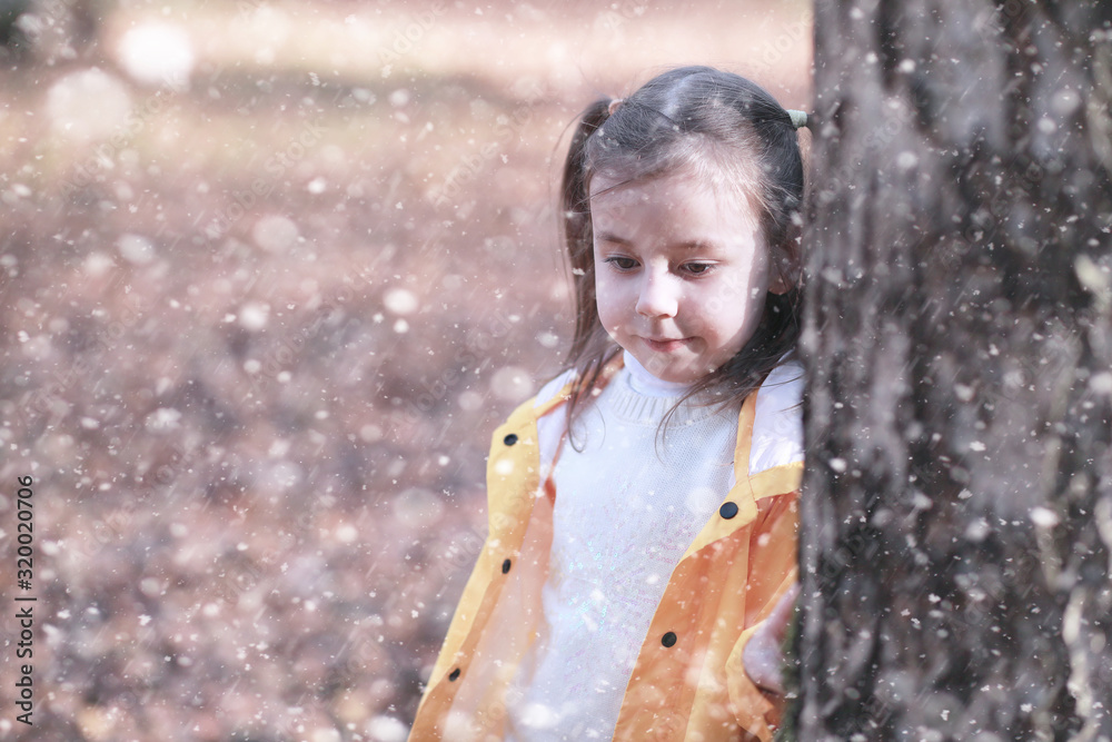 Kids walk in the park first snow Kids walk in the park first snow