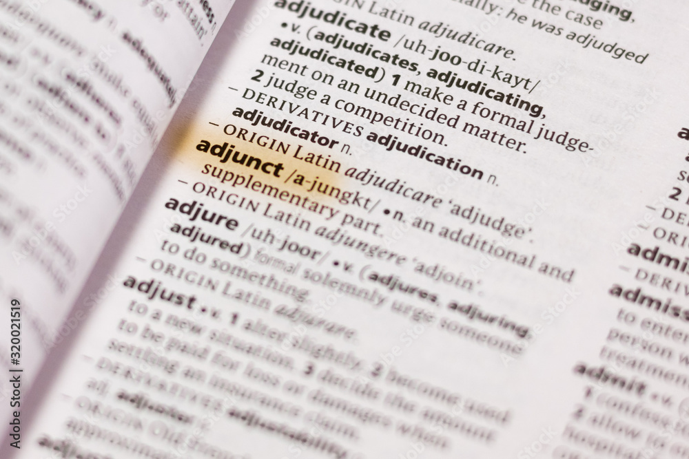 Ivanovsk, Russia - November 19, 2018: The word or phrase Adjunct in a dictionary. Ivanovsk, Russia - November 19, 2018: The word or phrase Adjunct in a dictionary.