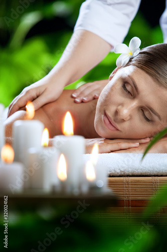 portrait of young beautiful woman in spa environment. 