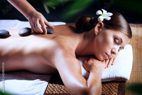 portrait of young beautiful woman in spa environment