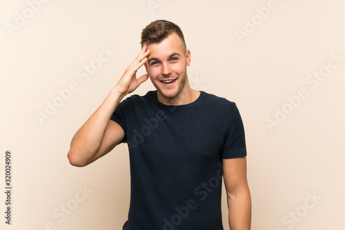 Young handsome blonde man over isolated background has just realized something and has intending the solution