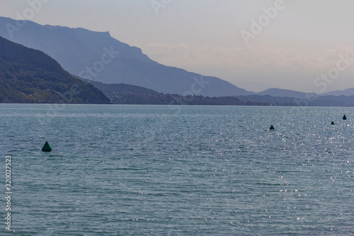 Beautiful summer landscape: blue lake surrounded by mountains, sunny day, France, Lac du Bourget