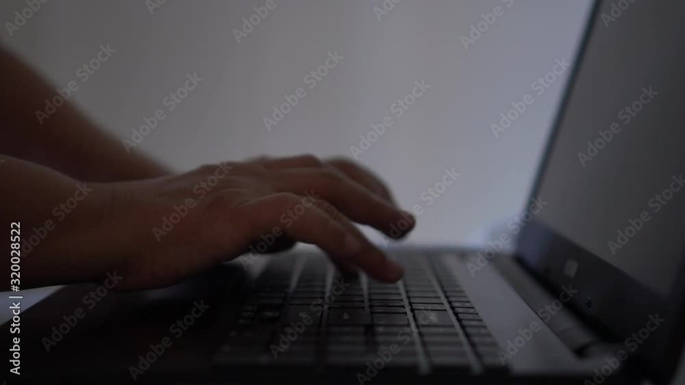 Hands of hacker or cyber crime typing coding keys on laptop keyboard computer, Attack signifying internet theft while using online banking, anonymous business in technology networking concept Hands of hacker or cyber crime typing coding keys on laptop keyboard computer, Attack signifying internet theft while using online banking, anonymous business in technology networking concept