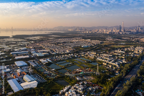 Aerial View of rural green fields in Hong Kong border and skylines in Shenzhen,China