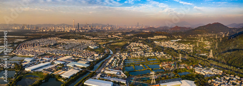 Aerial View of rural green fields in Hong Kong border and skylines in Shenzhen,China © Earnest Tse