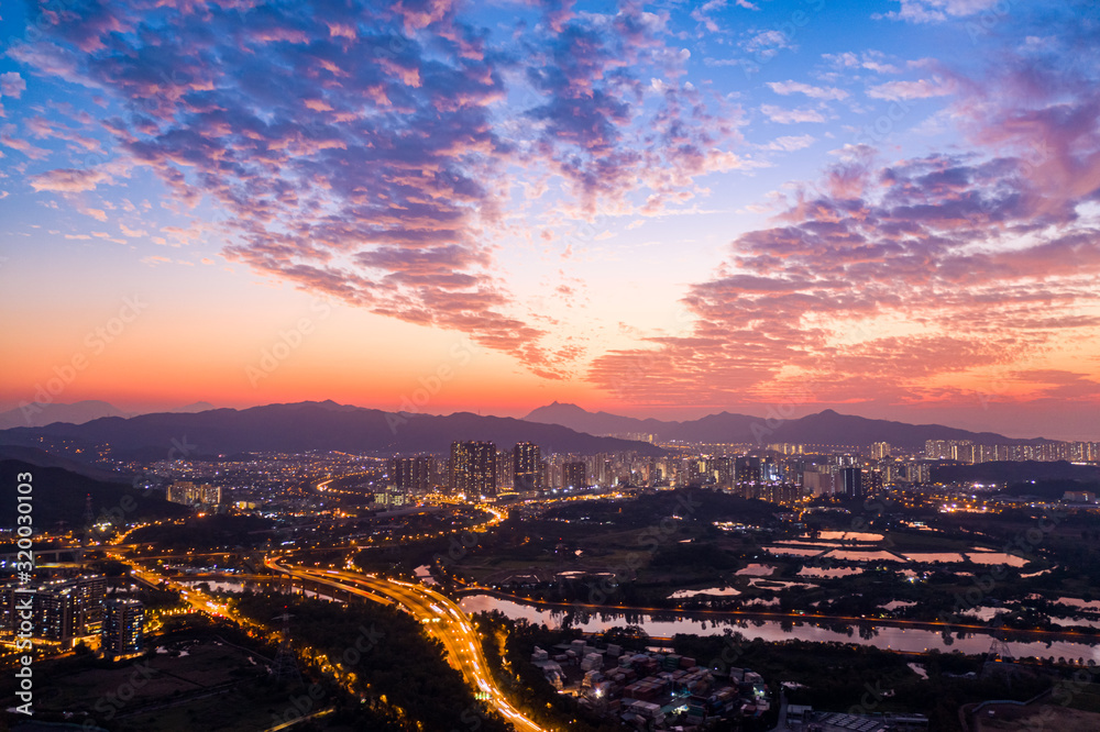 Obraz premium Aerial View of rural green fields in Hong Kong border and skylines in Shenzhen,China