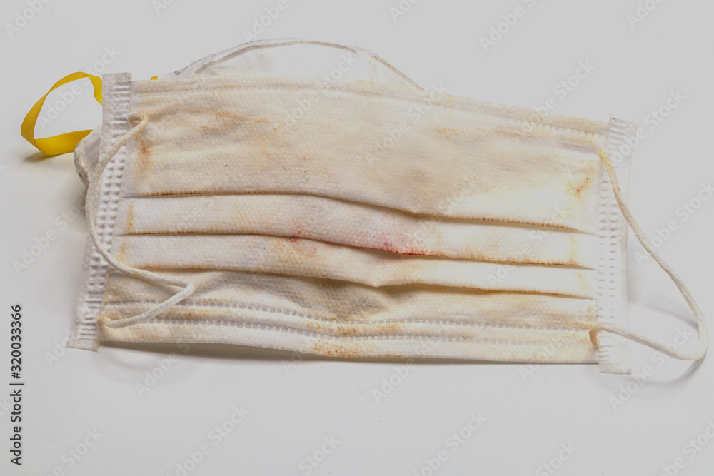 Old and dirty face mask isolate on white background.Close up disposable face  mask. Stock Photo | Adobe Stock