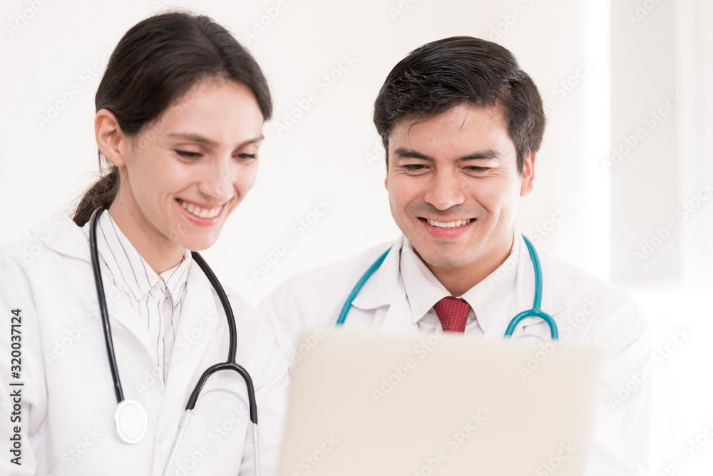 Two doctors have working together with happiness in the hospital. Two doctors have working together with happiness in the hospital.