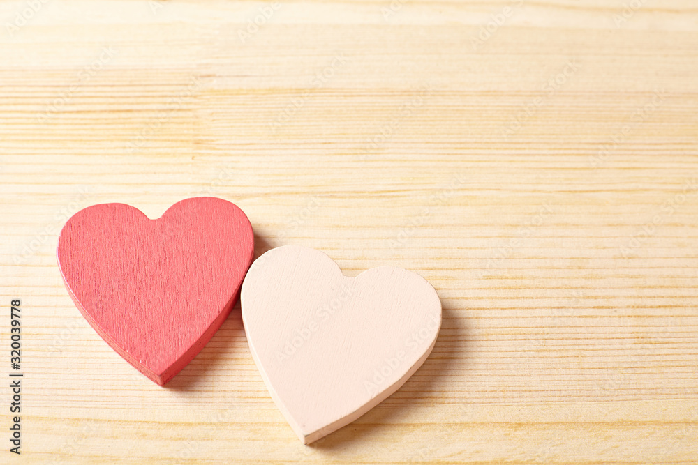 two hearts on wooden background two hearts on wooden background