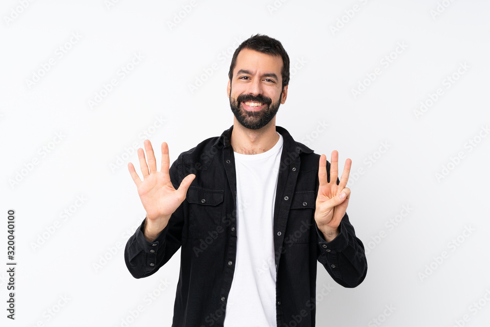 Young man with beard over isolated white background counting eight with fingers Young man with beard over isolated white background counting eight with fingers