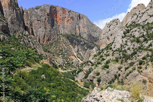Kazankaya Canyon in Yozgat region in Turkey. Breathtaking view of the high red mountains of the gorge. Travel theme.