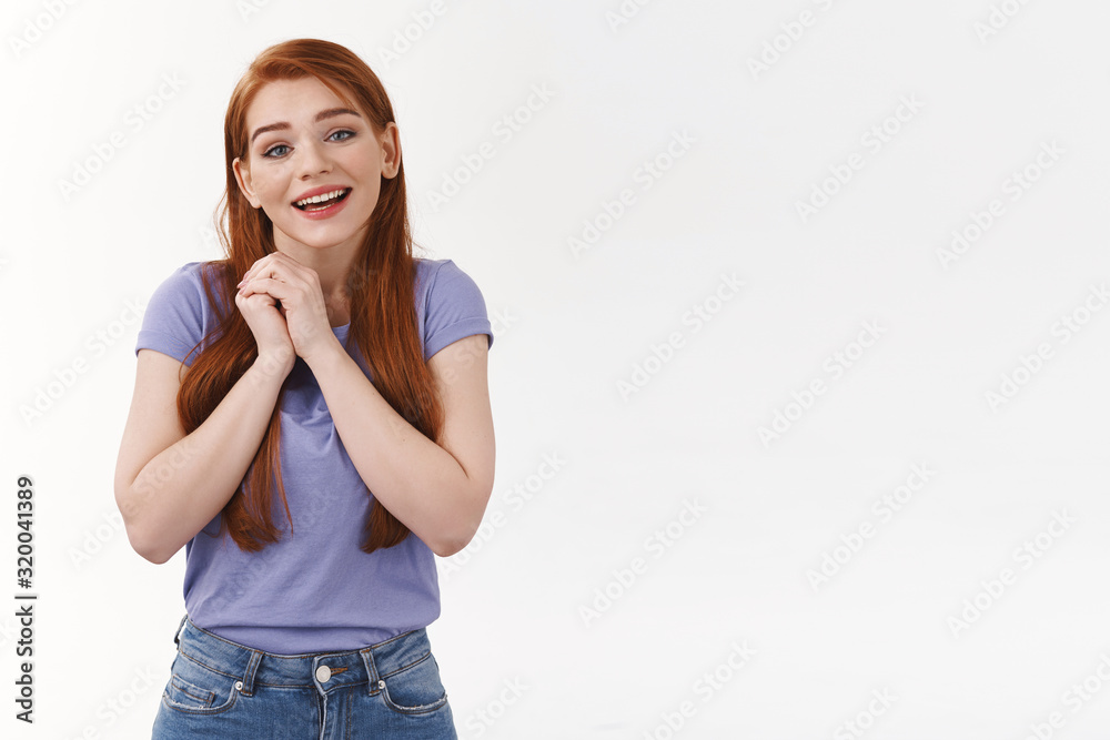 Tenderness, affection and love concept. Charming romantic girlfriend with long red hair, clench hands together near heart and sighing with admiration, adore something beautiful and cute, smiling Tenderness, affection and love concept. Charming romantic girlfriend with long red hair, clench hands together near heart and sighing with admiration, adore something beautiful and cute, smiling