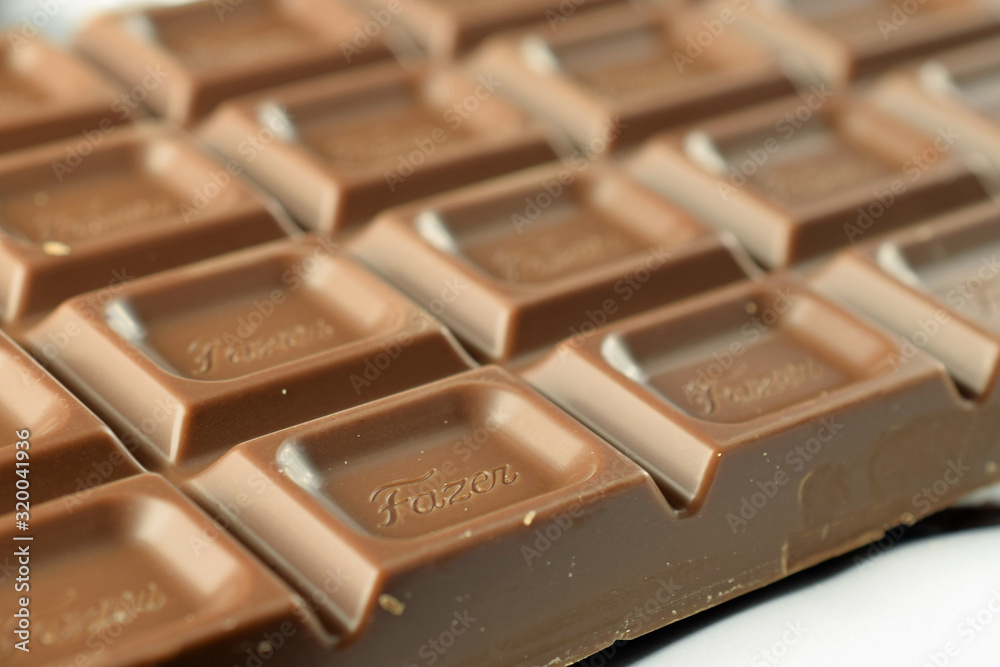 TURKU, FINLAND April 1, 2019 Opened chocolate bar. Karl Fazer Milk