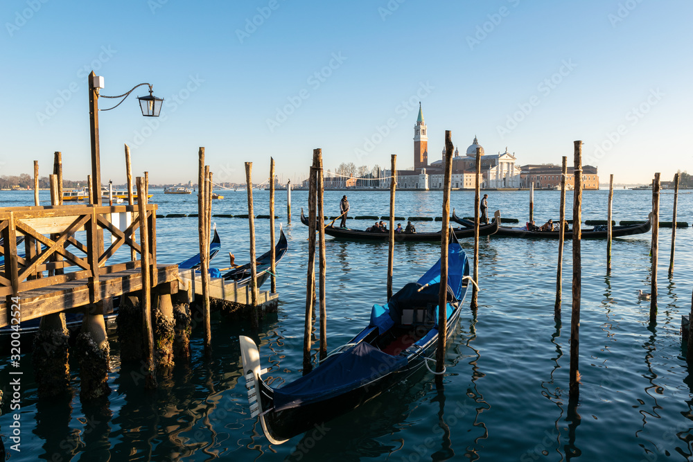 Gondolas in Venice at golden hour