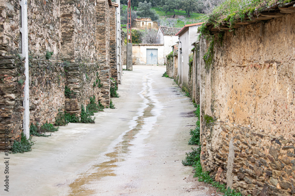 Rural street in a town in western Spain on a rainy day