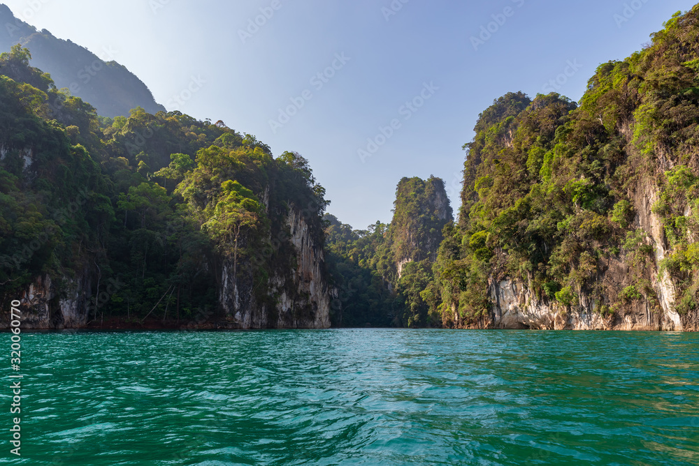 Limestone mountains with trees in the sea in Thailand