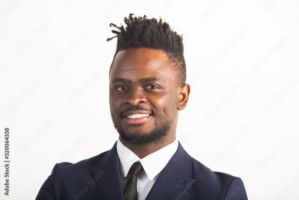 handsome young african man in a suit on a white background handsome young african man in a suit on a white background